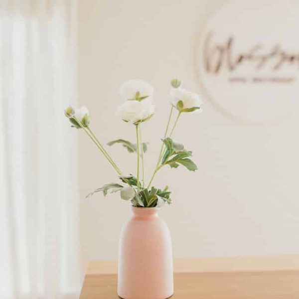 A Vase Of Flowers On A Table