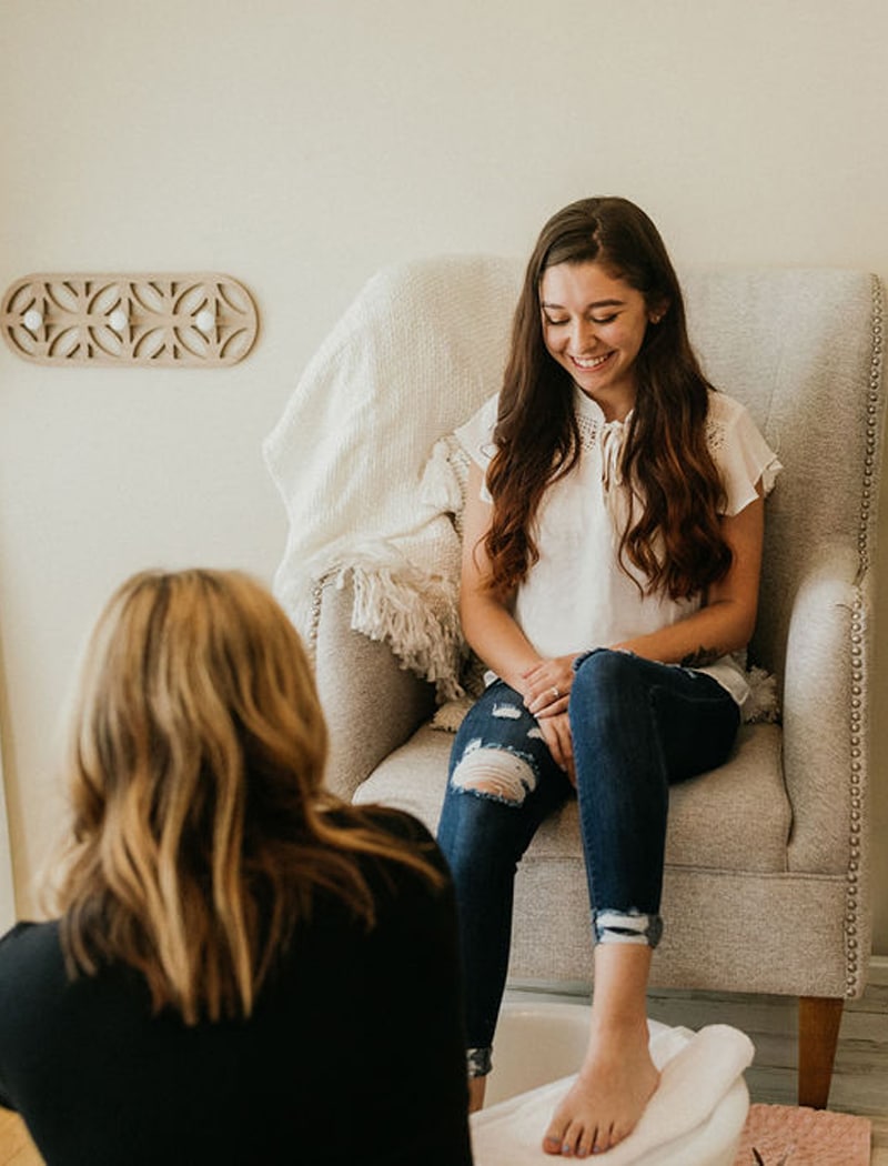 a woman sitting on a couch