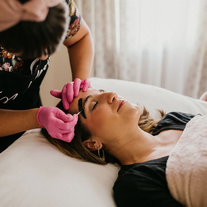 a woman sitting on a bed