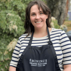 a person in a striped shirt and smiling at the camera